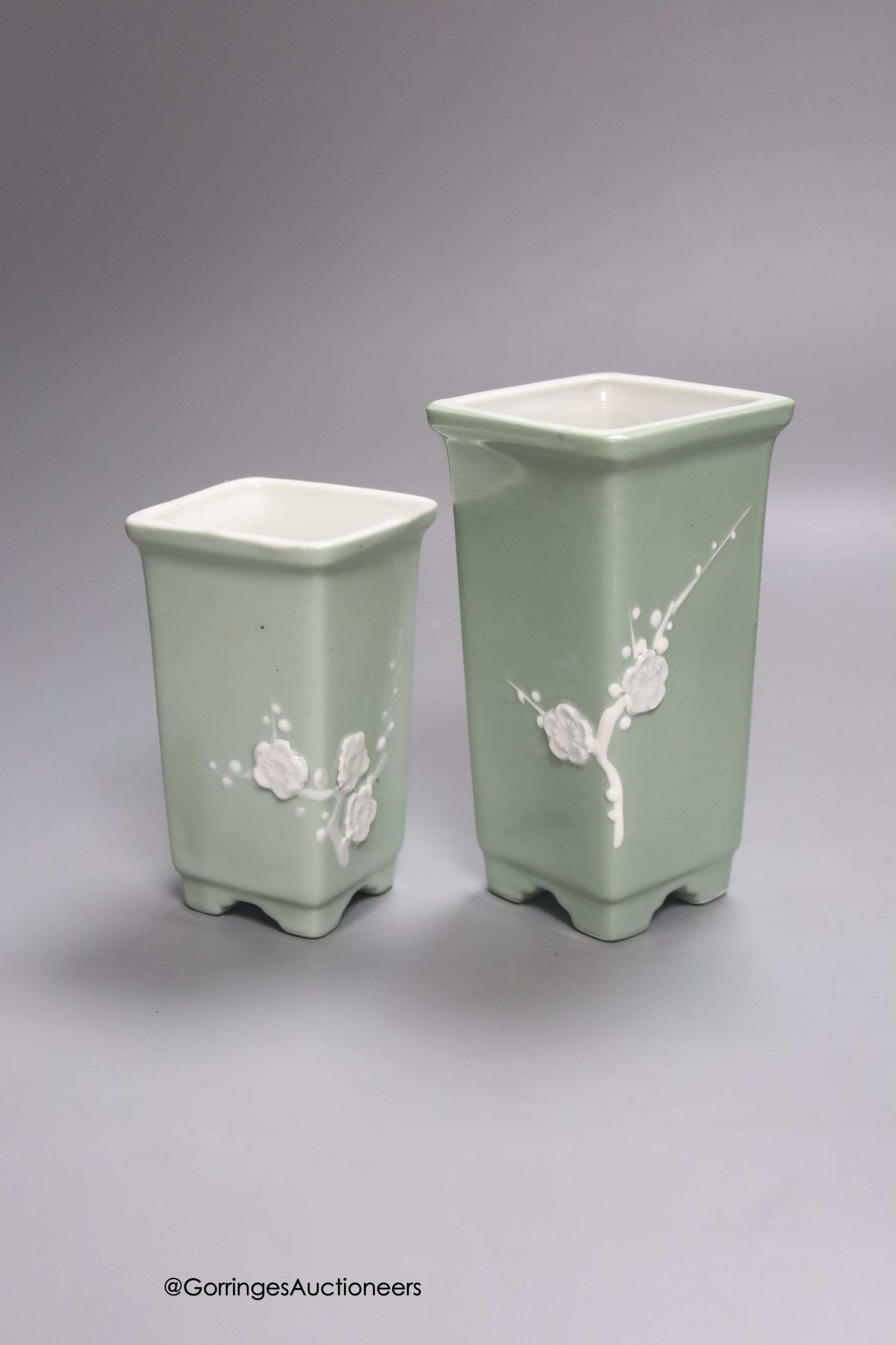 A Chinese famille rose bottle vase and a similar jar and cover and two celadon glazed vases, tallest 24cm